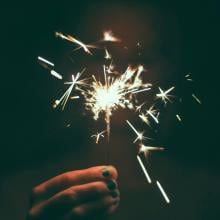 Person holding a sparkler 