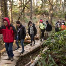 Students hiking through the woods