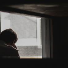 Man looking out a window