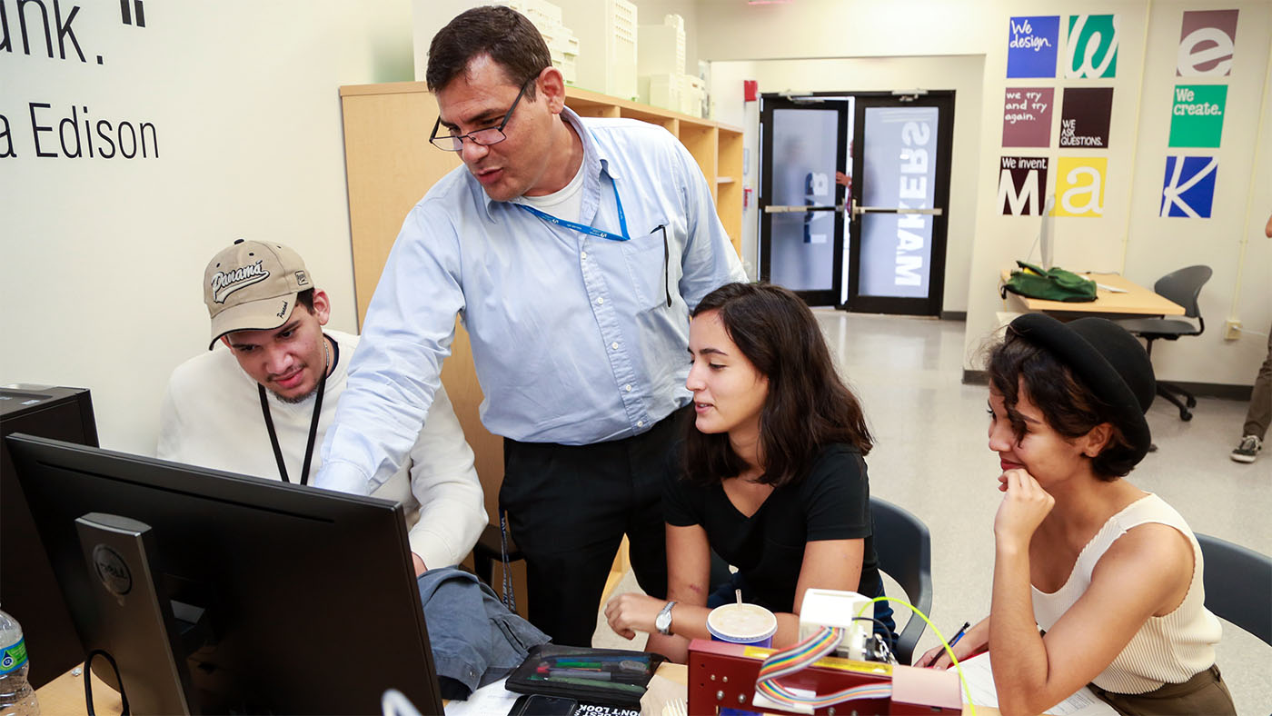 MDC faculty and students engaged in a class setting